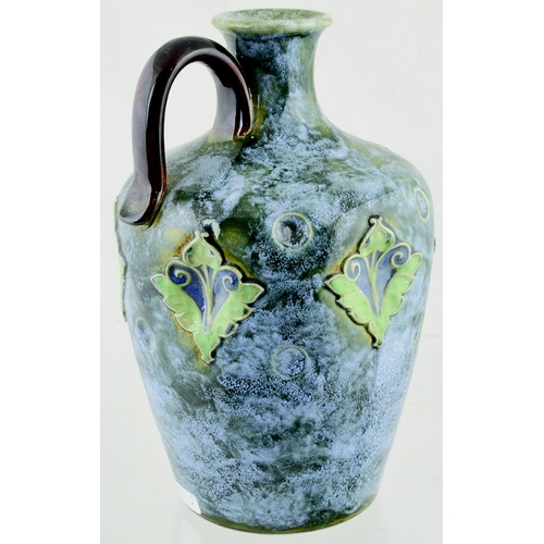 636 - ARTWARE WHISKY JUG. (WG p 226) 8ins tall. Mottled green with raised floral detail in shades of blue,... 