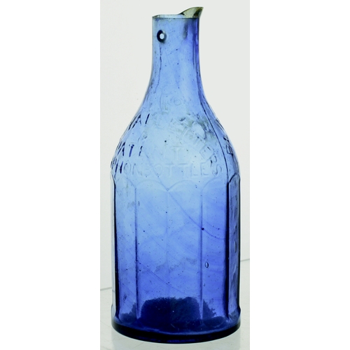 580 - BLACKWOODS PATENT INK DECANTER. 6.5ins tall. Cobalt blue glass, embossed as previous lot. Full of da... 