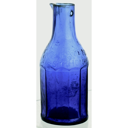 581 - BLACKWOODS PATENT INK DECANTER. 5ins tall. Dark cobalt blue glass, embossed as previous 2 lots. Pour... 