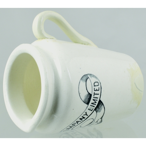 592 - LONDON CREAM JUG. 3.5ins tall. Black transfer, rear handle WEST LONDON COMPANY/ DAIRY within ribbon ... 