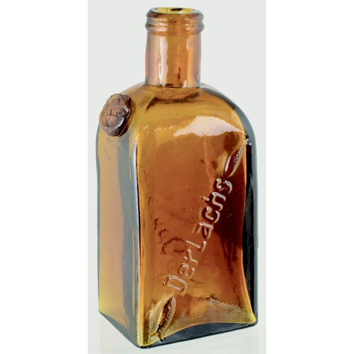 617 - MINIATURE GERMAN LIQUEUR BOTTLE. 4.25ins tall. Rectangular form, round shouldered, amber glass bottl... 