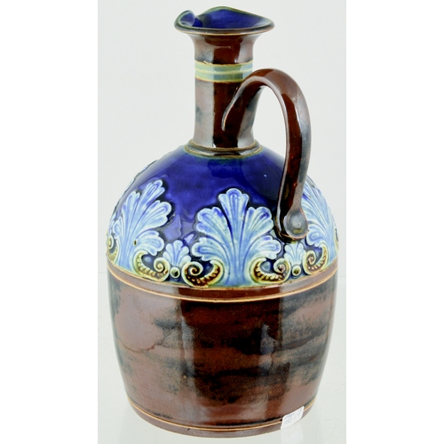 632 - ARTWARE WHISKY JUG. 9ins tall. Blue top, lower brown glaze, raised foliate detail & SCOTCH below lon... 