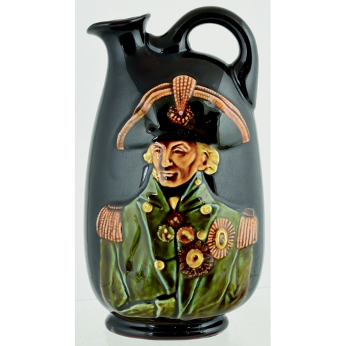 637 - NELSON KINGSWARE FLASK. (JL p 32) 8.5ins tall. Flattened oviform flask, side handle, image of Nelson... 