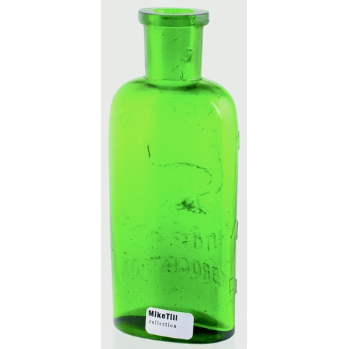 671 - BARRETTS MANDRAKE EMBR-OCATION BOTTLE. 4.5ins tall, bright green glass, rectangular shape with round... 