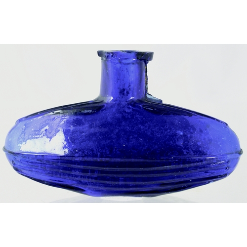 675 - SUBMARINE POISON BOTTLE. (DP p 24) 2.5ins tall. Cobalt blue glass, embossed POISON to front REGISTER... 