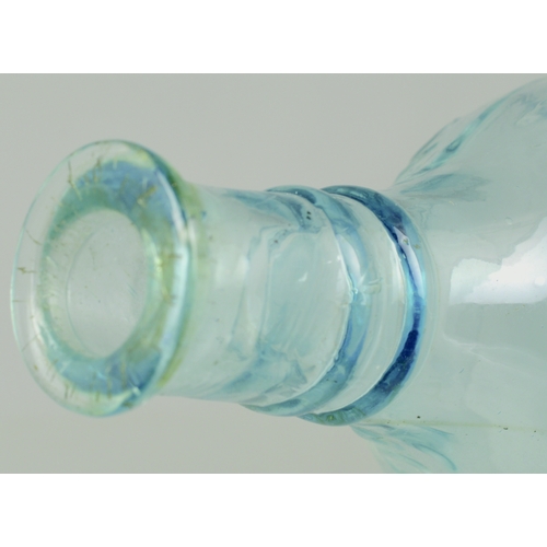 676 - QUINES POISON BOTTLE. (DP p 34) 5.75ins long. Ice blue glass, embossed POISON either side neck area ... 