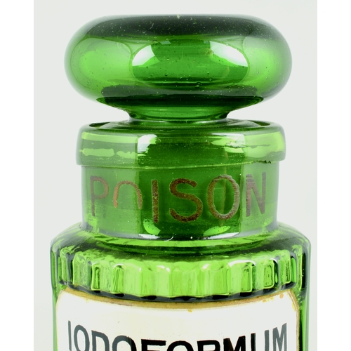 681 - PHARMACY CHEMIST BOTTLE. 4.5ins tall to top of domed stopper. Green glass, vertically ribbed, POISON... 