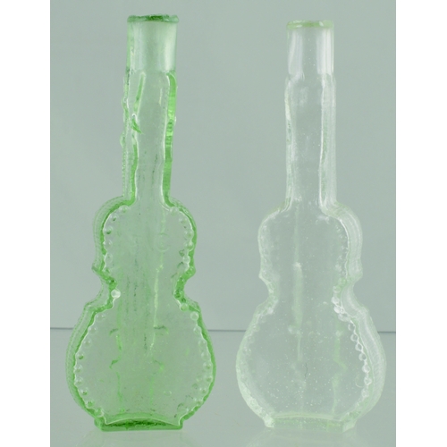 696 - VIOLIN PERFUMES DUO. 5ins tall. One aqua, one clear glass, sheared lips, violin detail embossing one... 