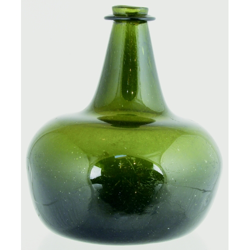 728 - SHAFT & GLOBE WINE BOTTLE. 6.5ins tall. Variating green glass, tapering neck, round body shape, wide... 