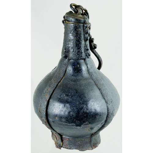 730 - GUNPOWDER FLASK? 8.5ins tall. Dredged from the River Thames many years ago this black glazed, potter... 