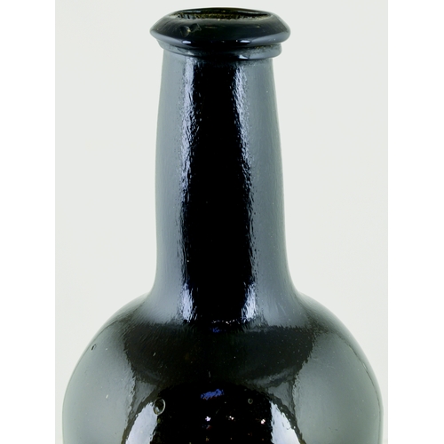 732 - SEALED CYLINDER WINE BOTTLE. 10.5ins tall. Very dark olive green glass, applied string rim lip, fron... 