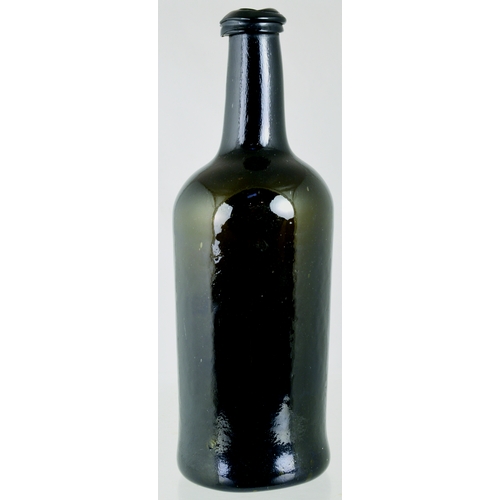 733 - SEALED CYLINDER WINE BOTTLE. 10.5ins tall. As previous lot, this having a more crude/ large double c... 