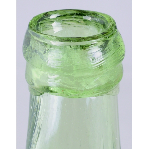 735 - UTILITY BOTTLE. 6.75ins tall. Aqua glass, rectangular shape, chamfered corners, long neck. Applied l... 