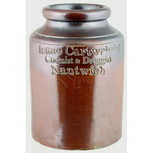 704 - NANTWICH CHEMISTS JAR. 10ins tall. Wide mouthed, variating dark tan salt glaze, front impressed ISSA... 