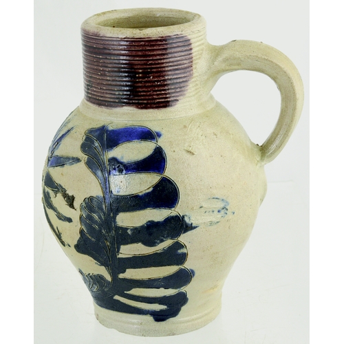 698 - WESTERWALD SALT GLAZED DRINKING JUG. 6ins tall. C.1715-1760, grey glaze, ribbed neck, dark blue body... 