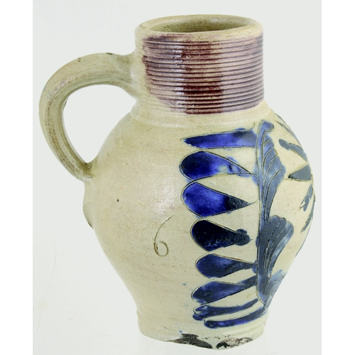 698 - WESTERWALD SALT GLAZED DRINKING JUG. 6ins tall. C.1715-1760, grey glaze, ribbed neck, dark blue body... 