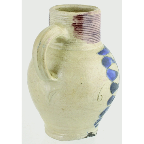 698 - WESTERWALD SALT GLAZED DRINKING JUG. 6ins tall. C.1715-1760, grey glaze, ribbed neck, dark blue body... 