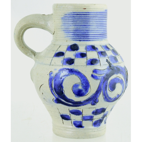 699 - WESTERWALD SALT GLAZED DRINKING JUG. 6ins tall. C.1715-1760, grey glaze, ribbed neck, dark blue body... 