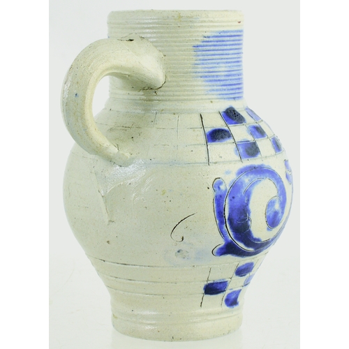 699 - WESTERWALD SALT GLAZED DRINKING JUG. 6ins tall. C.1715-1760, grey glaze, ribbed neck, dark blue body... 