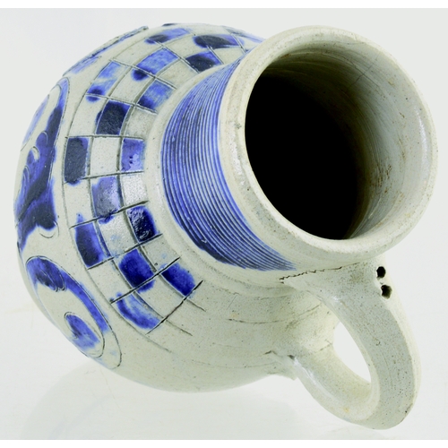 699 - WESTERWALD SALT GLAZED DRINKING JUG. 6ins tall. C.1715-1760, grey glaze, ribbed neck, dark blue body... 