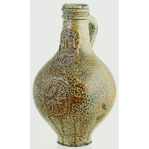 700 - BELLARMINE. 8.5 ins tall. Bulbous bodied Bellarmine jug in grey/ brown tiger glaze, bearded face to ... 