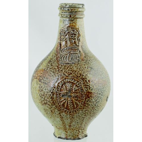 700 - BELLARMINE. 8.5 ins tall. Bulbous bodied Bellarmine jug in grey/ brown tiger glaze, bearded face to ... 