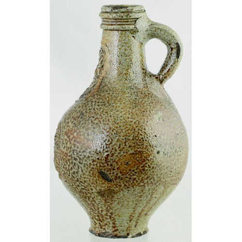 700 - BELLARMINE. 8.5 ins tall. Bulbous bodied Bellarmine jug in grey/ brown tiger glaze, bearded face to ... 