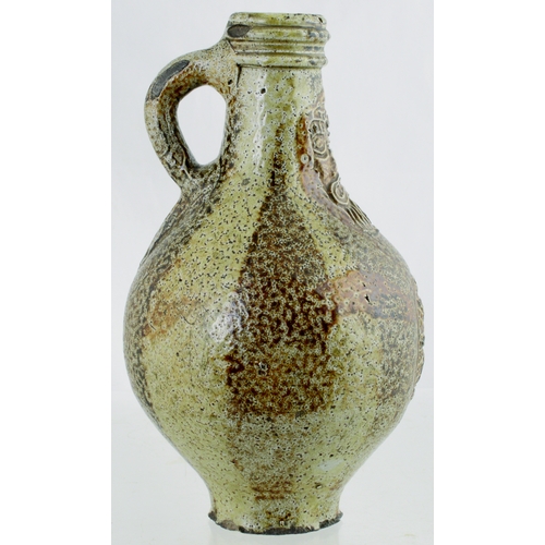 700 - BELLARMINE. 8.5 ins tall. Bulbous bodied Bellarmine jug in grey/ brown tiger glaze, bearded face to ... 