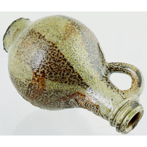 700 - BELLARMINE. 8.5 ins tall. Bulbous bodied Bellarmine jug in grey/ brown tiger glaze, bearded face to ... 