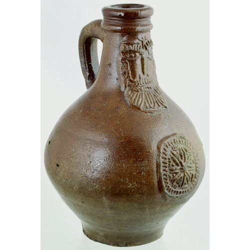 701 - BELLARMINE. 8.5ins tall. Bulbous bodied Bellarmine jug in brown tiger glaze, bearded face to neck, d... 