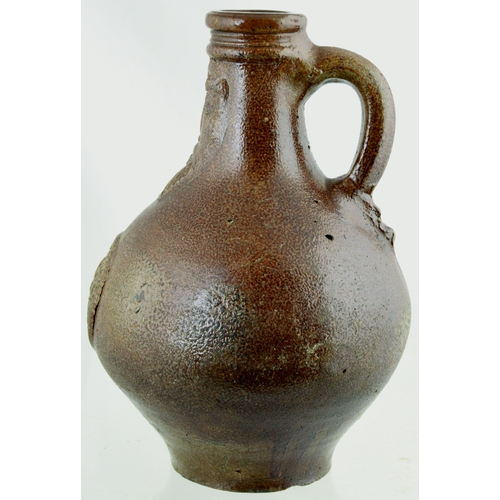 701 - BELLARMINE. 8.5ins tall. Bulbous bodied Bellarmine jug in brown tiger glaze, bearded face to neck, d... 