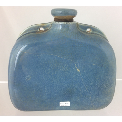 298 - VELRAY HOT WATER BOTTLE. 6.75ins tall to top of screw stopper. Pale blue glaze embossed front pict. ... 