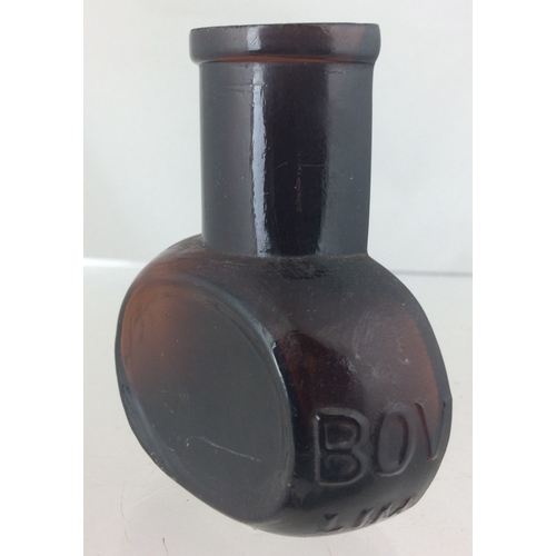 319 - SPLIT BOVRIL BOTTLE. 3.25ins, dark amber, embossed BOVRIL/ LIM 0848. Scarce. Good!