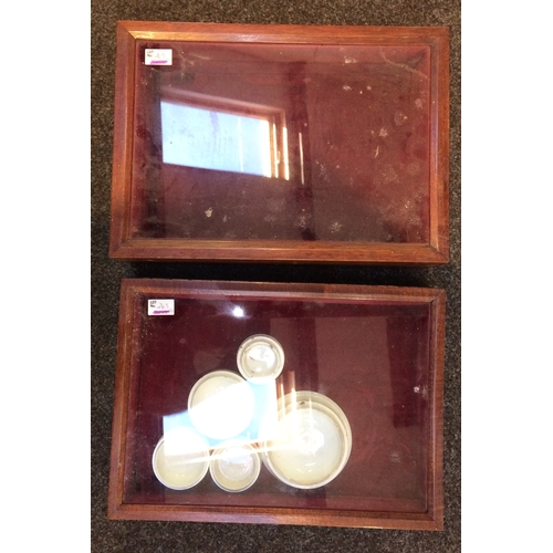 265 - DISPLAY CABINETS DUO. 11 x 16ins. Dark wood, glass fronts, red cushioned lining inside - plus five p... 