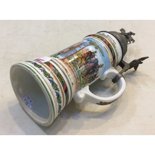 10 - IMPERIAL GERMAN MILITARY STEIN. 13ins, multicoloured, very decorative, handled. Pewter hinged lid wi... 