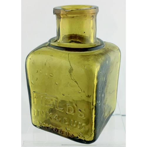 38 - FIELDS INK & GUM BOTTLE. 3.75ins tall. Square shape, amber glass, embossed front FIELD’S/ INK & GUM/... 