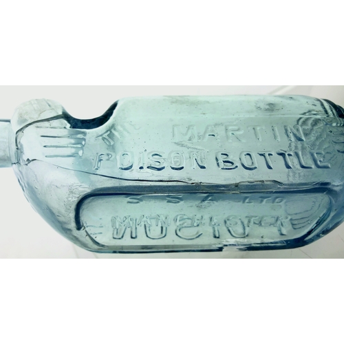 67 - MARTIN POISON BOTTLE. 7ins long. Ice blue glass, 8oz size, embossed THE MARTIN/ POISON BOTTLE one si... 