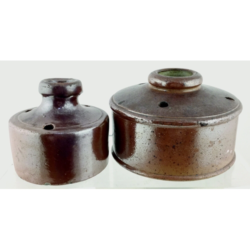 144 - STONEWARE INKS DUO. Largest 4ins diam. Circular form, shiny brown glaze pen holes atop. Underside ba... 