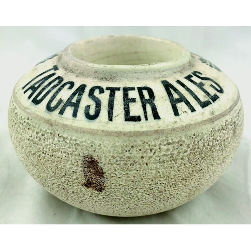 397 - JOHN SMITH’S TADCASTER ALES MATCHSTRIKER. 2.5ins tall, cream glaze, black lettering, circular body w... 