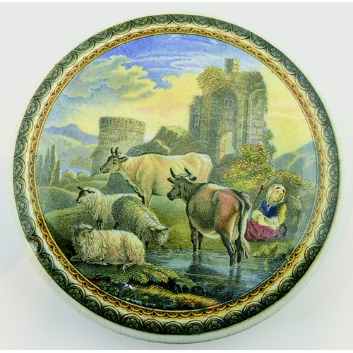 510 - CATTLE AND RUINS POT LID. (KM 275) 4.75ins diam. Multicoloured lid produced by the Pratt factory, wi... 