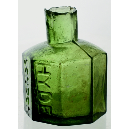 565 - HYDE INK. 2.25ins tall. Dark green glass, sheared lip (sliver). Octagonal shape, two front panels em... 