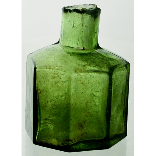 565 - HYDE INK. 2.25ins tall. Dark green glass, sheared lip (sliver). Octagonal shape, two front panels em... 