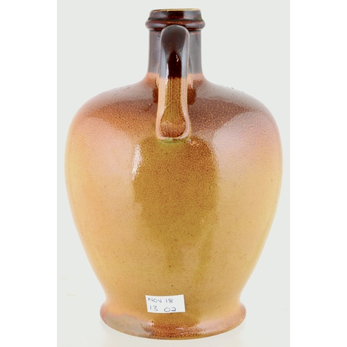 620 - J.R.D. SCOTCH WHISKY JUG. (WG p 157) 7ins tall. Variating tan salt glaze, rear handle, applied front... 