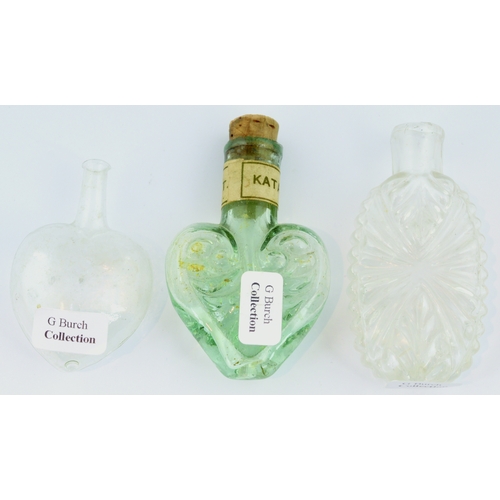 652 - PENNY PERFUMES TRIO. Tallest 2.5ins. Two clear glass, heart shape & multi-facetted variant, plus aqu... 