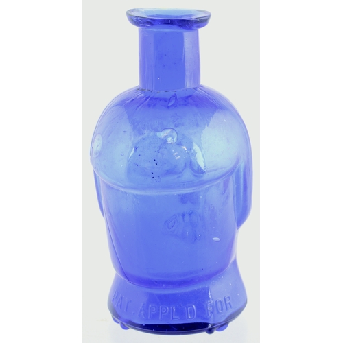 654 - SKULL POISON BOTTLE. (DP p 20) 4.25ins tall. Vivid cobalt blue glass formed as skull, crossed bones ... 