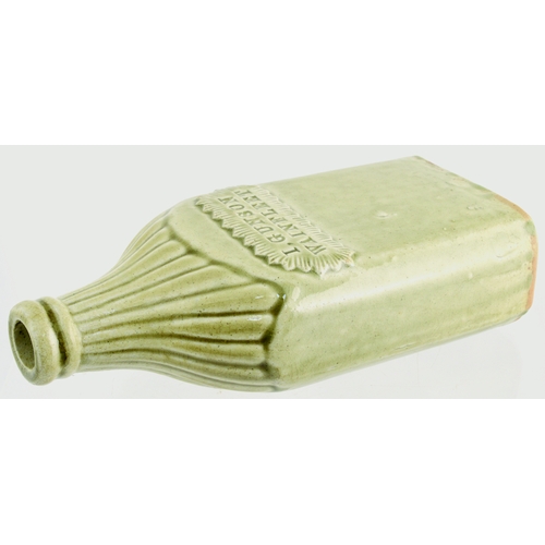 681 - WAINFLEET SLAB SEAL FLASK. 9ins tall. Grey/ green slip glaze flask, sloping ribbed shouldered, recta... 