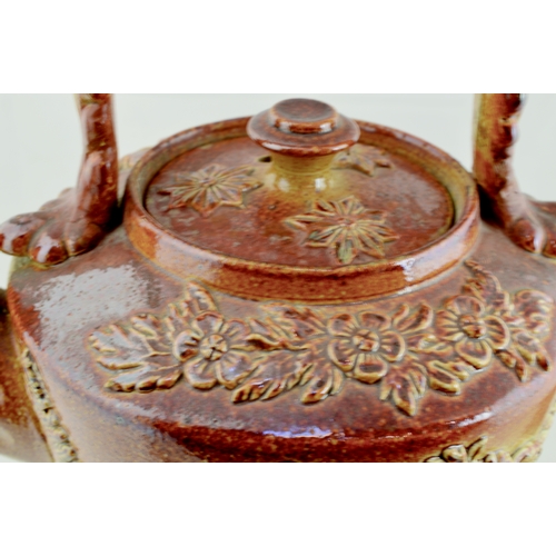 683 - BRAMPTON TEAPOT & STAND. Variating tan salt glaze teapot with various highly detailed sprigs: flower... 