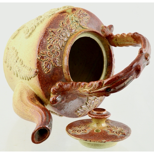 683 - BRAMPTON TEAPOT & STAND. Variating tan salt glaze teapot with various highly detailed sprigs: flower... 