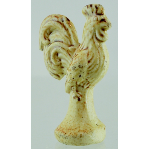 685 - BRAMPTON SALT GLAZE PIPE TAMPER. 1.5ins tall. Detailed cockerel shaped pipe tamper, c. 1820’s, light... 