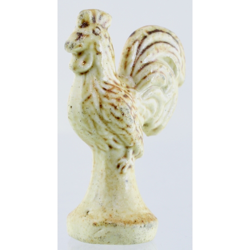 685 - BRAMPTON SALT GLAZE PIPE TAMPER. 1.5ins tall. Detailed cockerel shaped pipe tamper, c. 1820’s, light... 